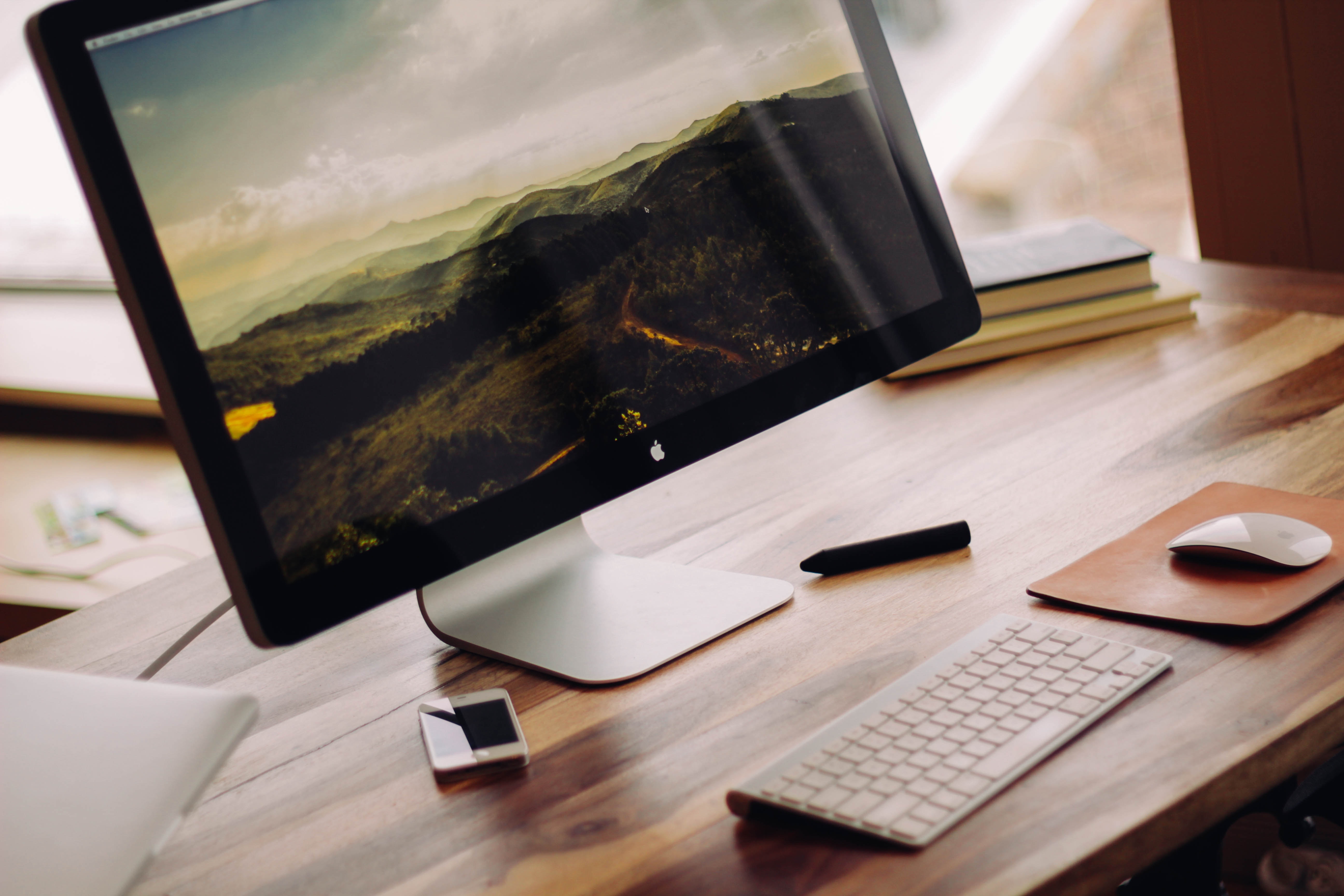 photo of desktop computer screen on a desk