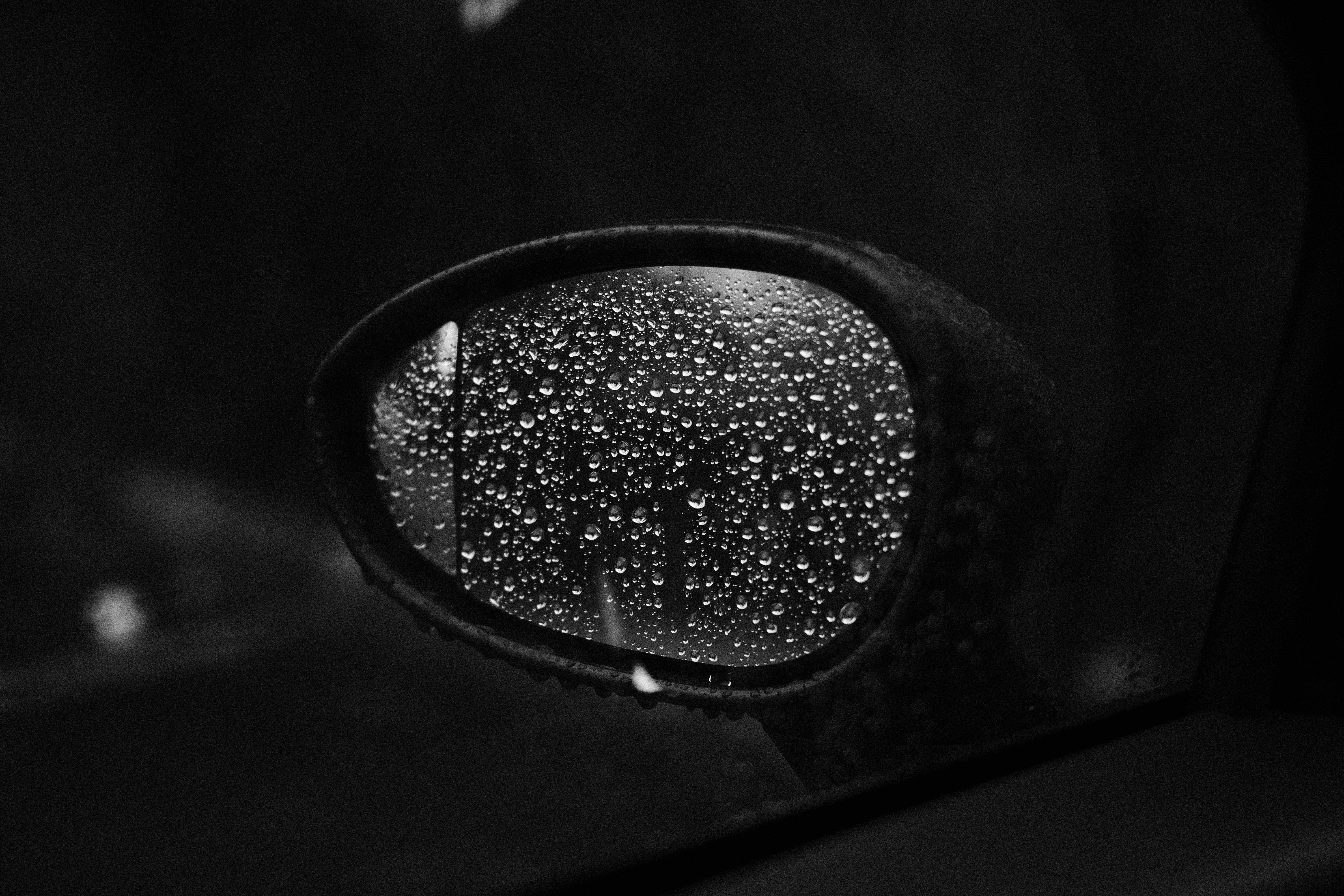 photo of side car mirror with rain dewdrops